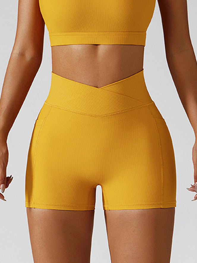 Basic crossover hip lift side pocket track yoga shorts