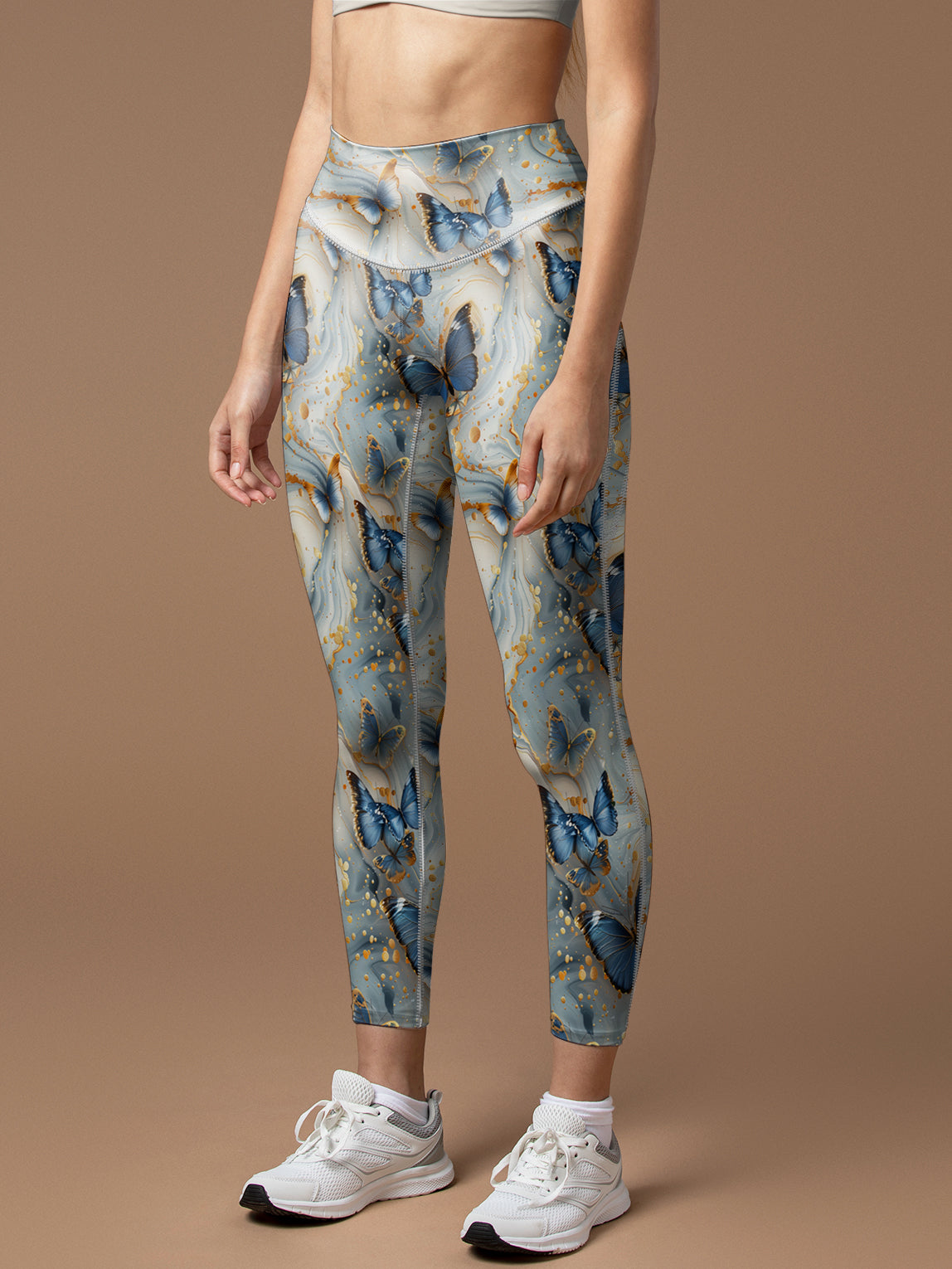 Butterfly floating in gilt water ripples leggings