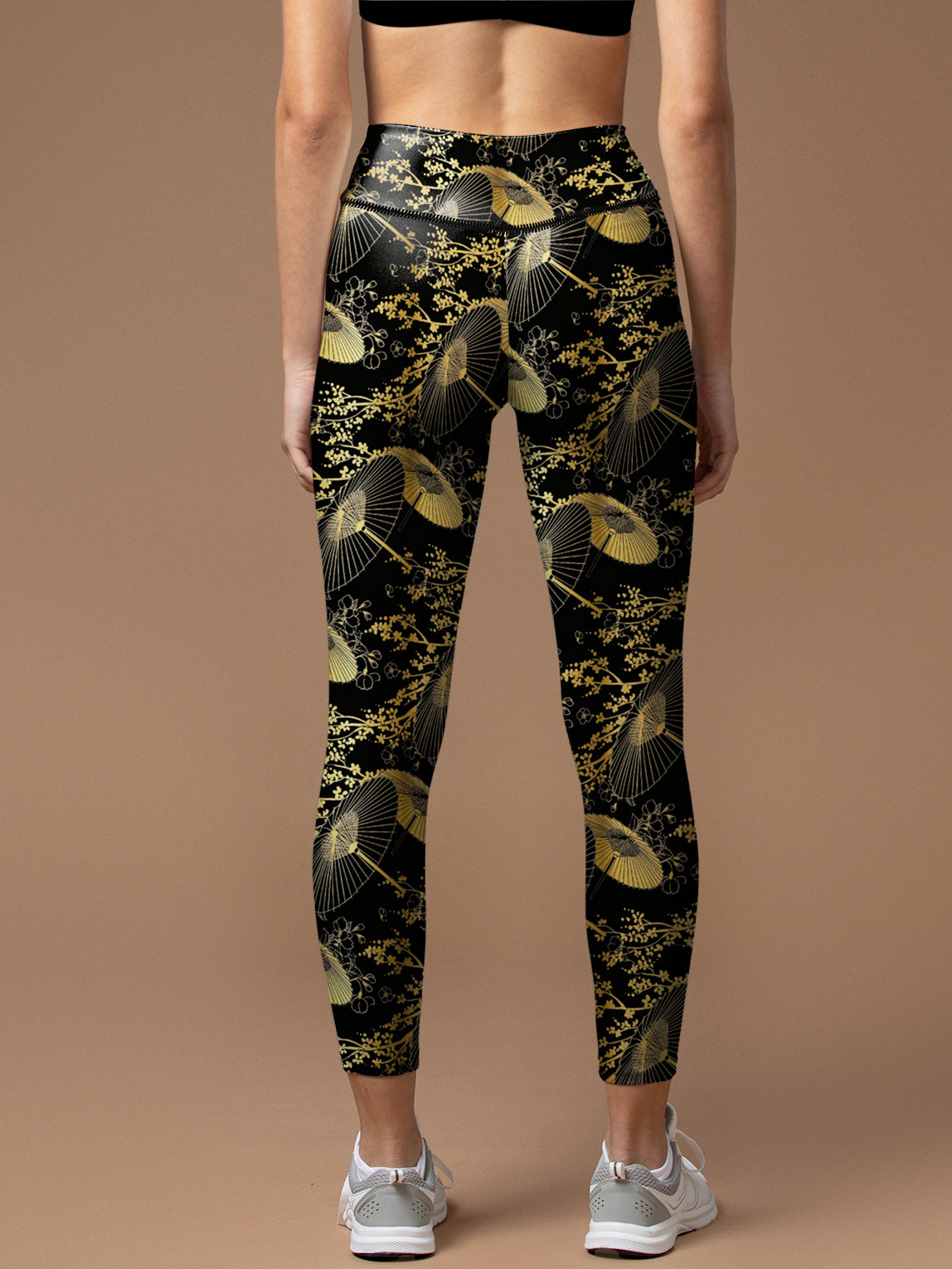 Deaturing gold umbrella outlined in gold leggings